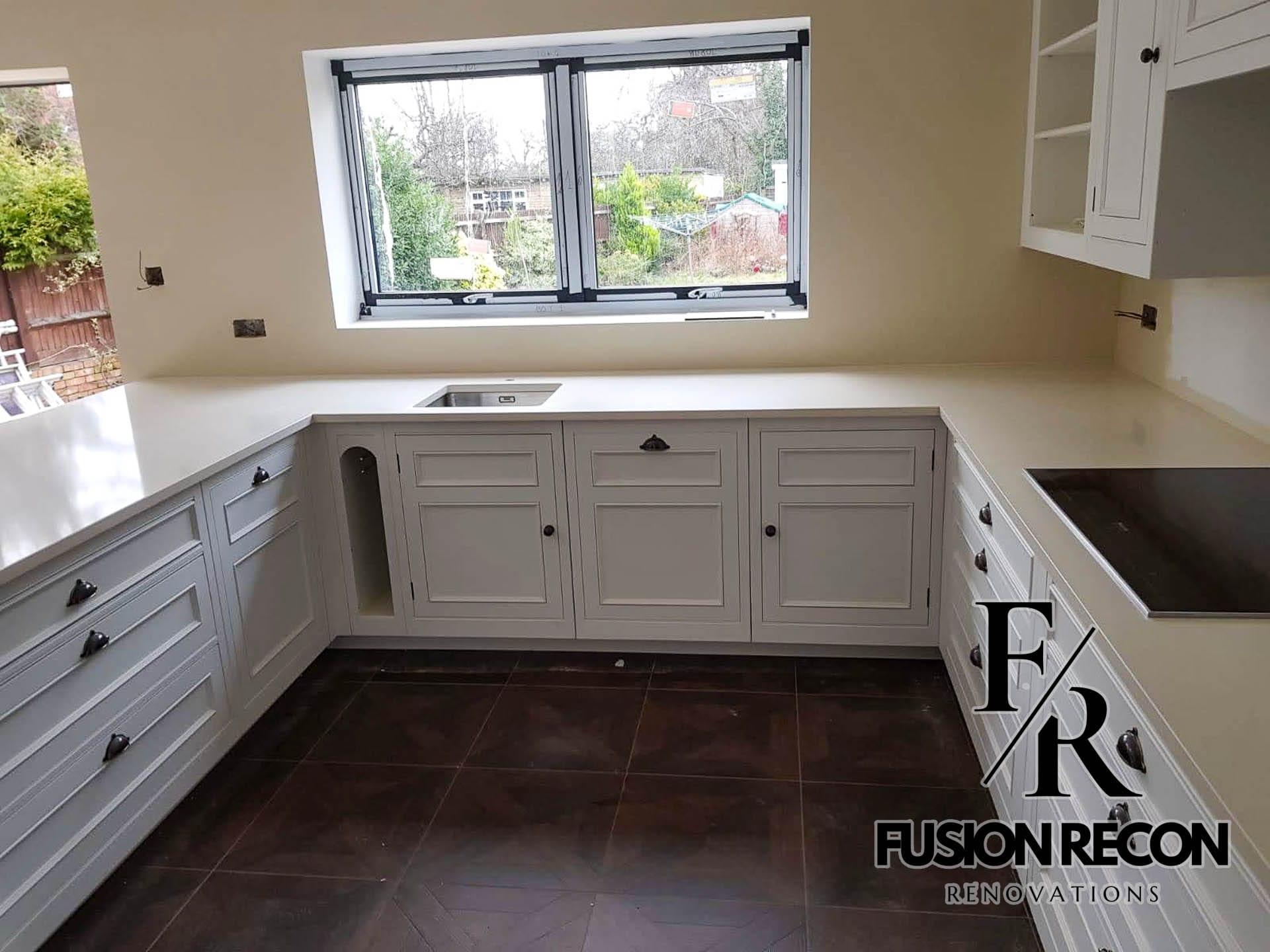 Bespoke C-shaped kitchen installation with integrated appliances – Putney SW15