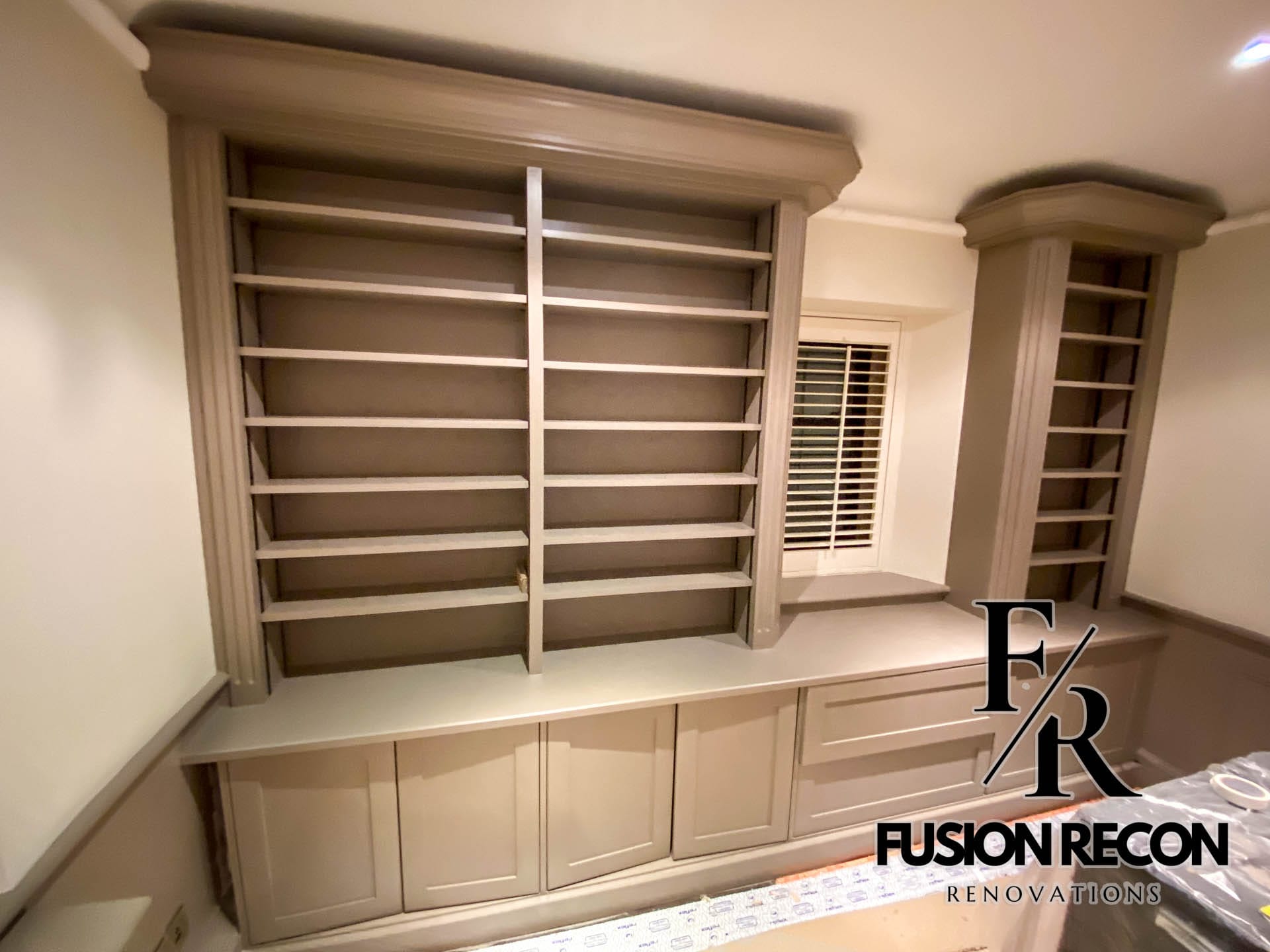 Bespoke custom library design with fitted cabinets and full-height bookshelves – Kensington W8